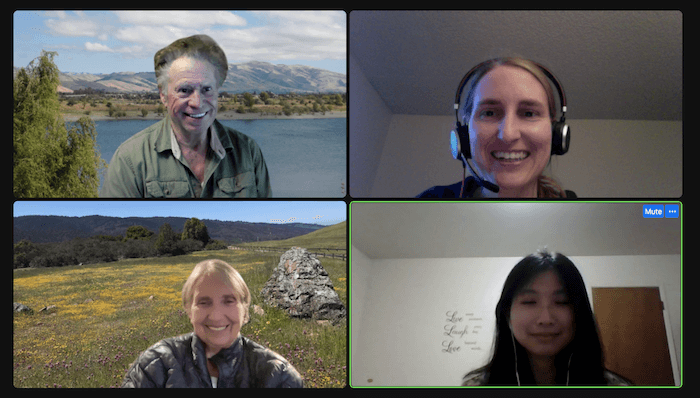 Screenshot of a Zoom conference call showing a grid of four photos, each showing a person's head and torso