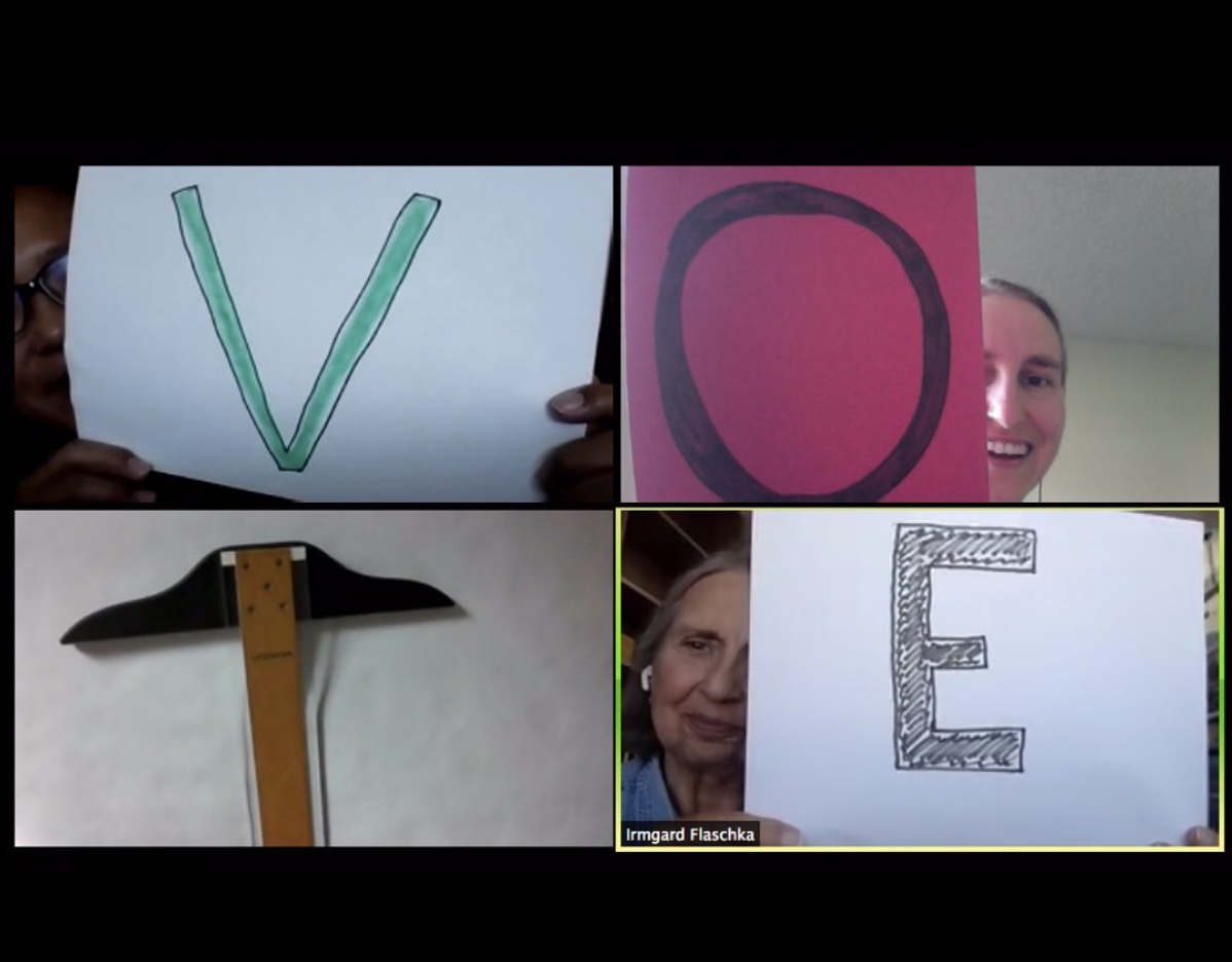 Screenshot of four people on a zoom screen, holding the letters V,O,T and E