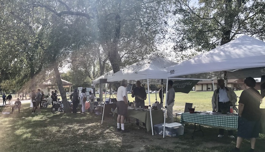 Photo of different environmental groups' tables, from the side